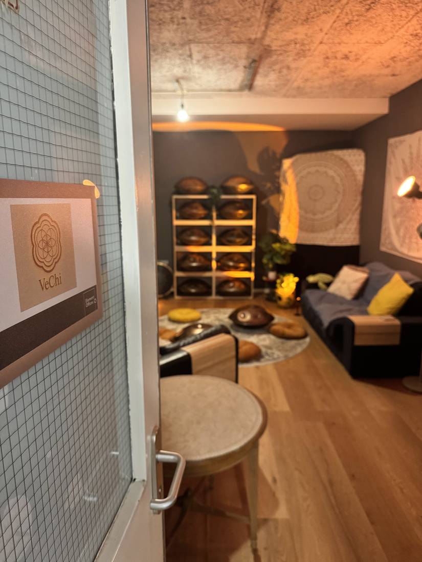The studio door with the VeChi logo, the room glowing behind it