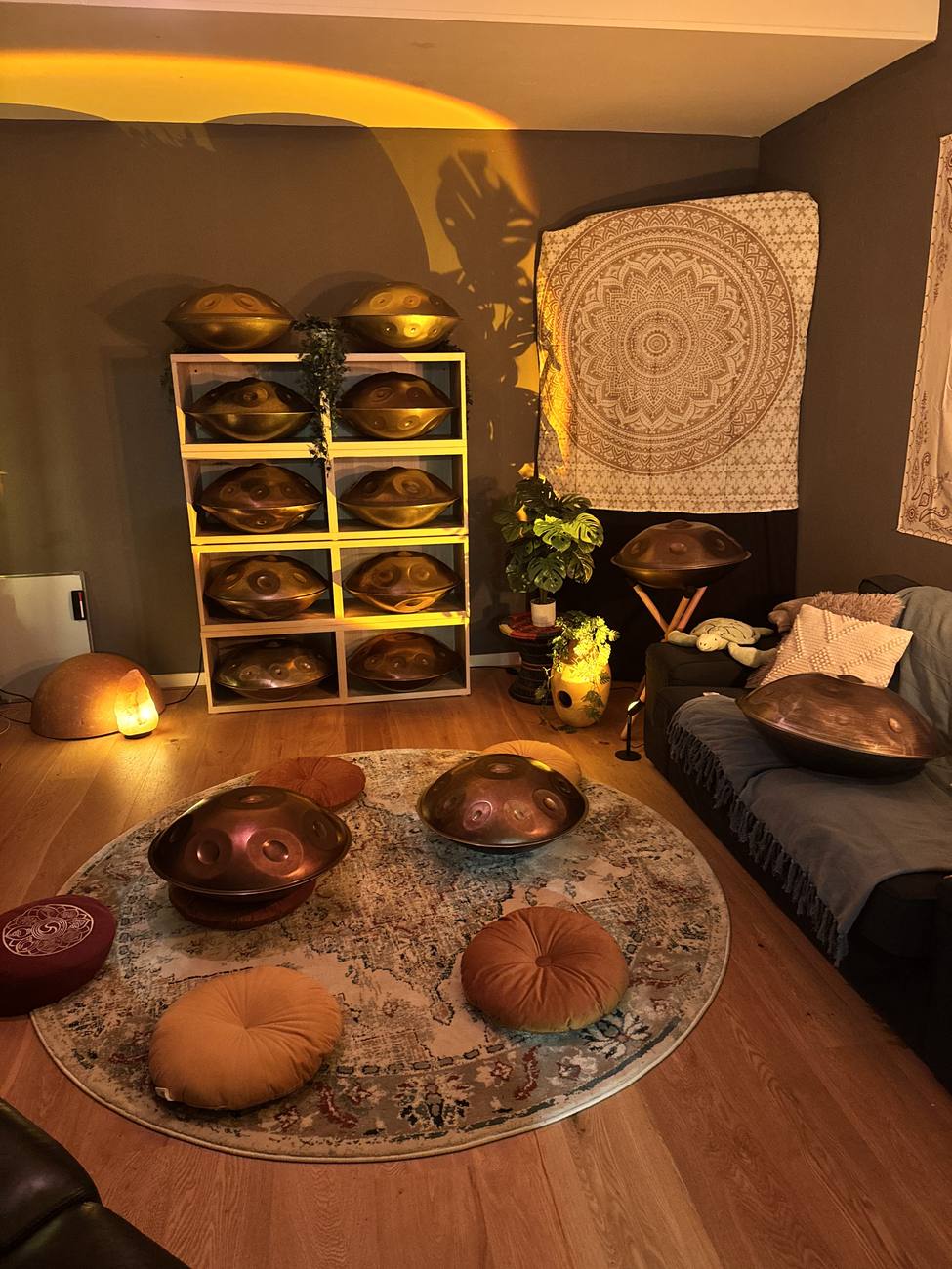 Handpans on cushions in warm light